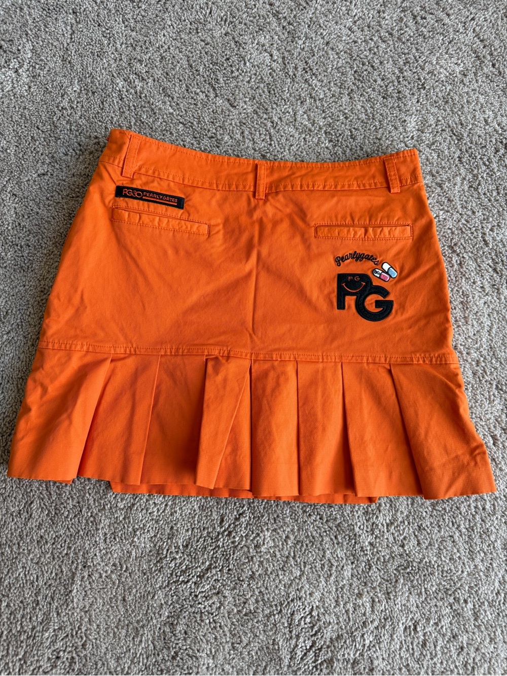 Pearly Gates Orange Pleated golf Skort embroidered patch’s size 1